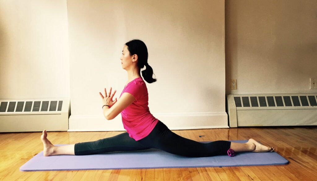 Yan in a balancing yoga posture - Yan Yoga gallery
